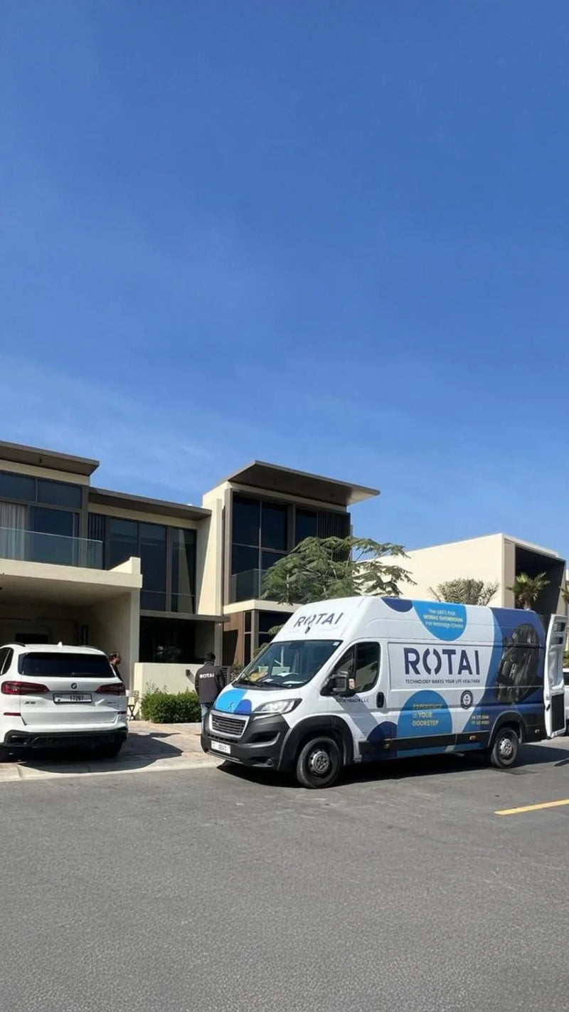 Rotai Health branded delivery van parked outside modern Dubai villa for home massage chair trial